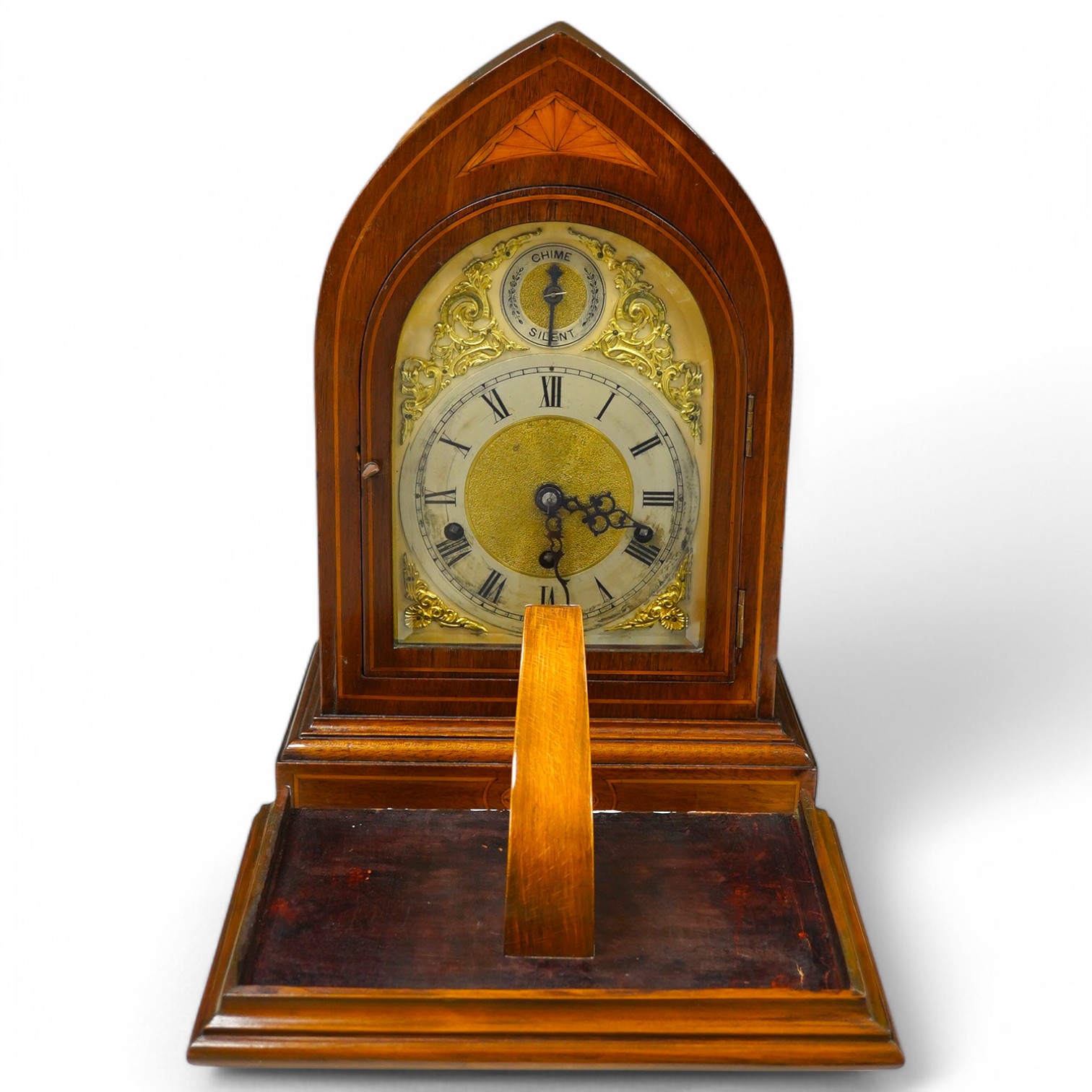 An Edwardian three train mahogany bracket clock and bracket, chiming on four coiled gongs, clock 42.5cm high. Condition - good